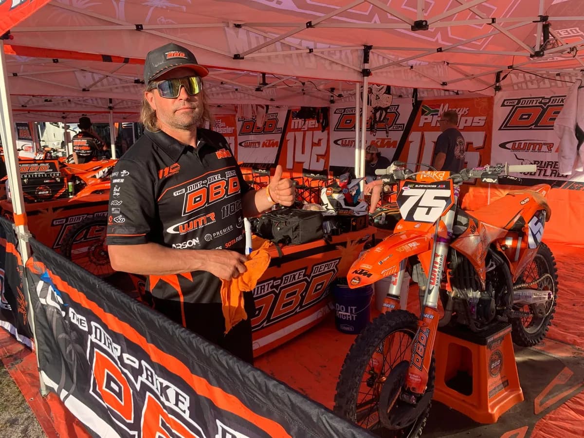 Race bikes on stands in the pits ready for setup work